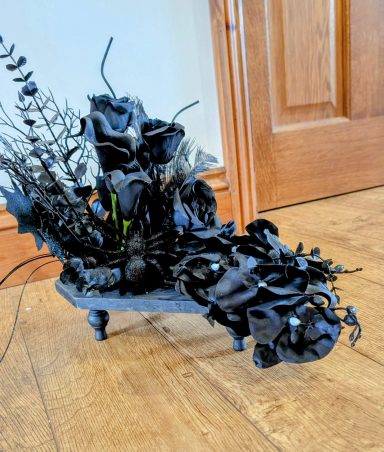 Coffin shape table top roses and lilies