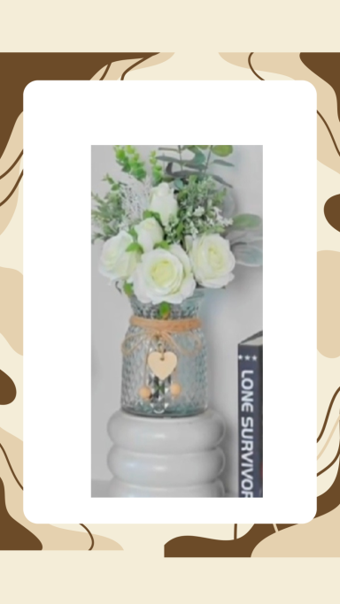 White roses in clear vase